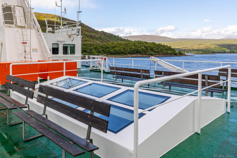 Top deck space showing skylights and bench seating.